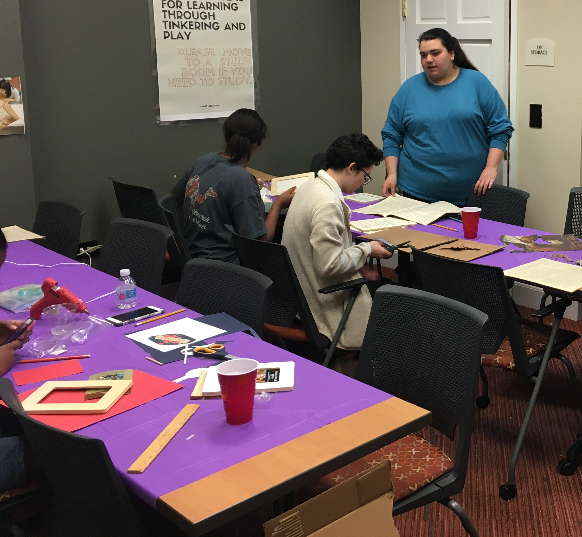 Group of students working on their crafts with books projects