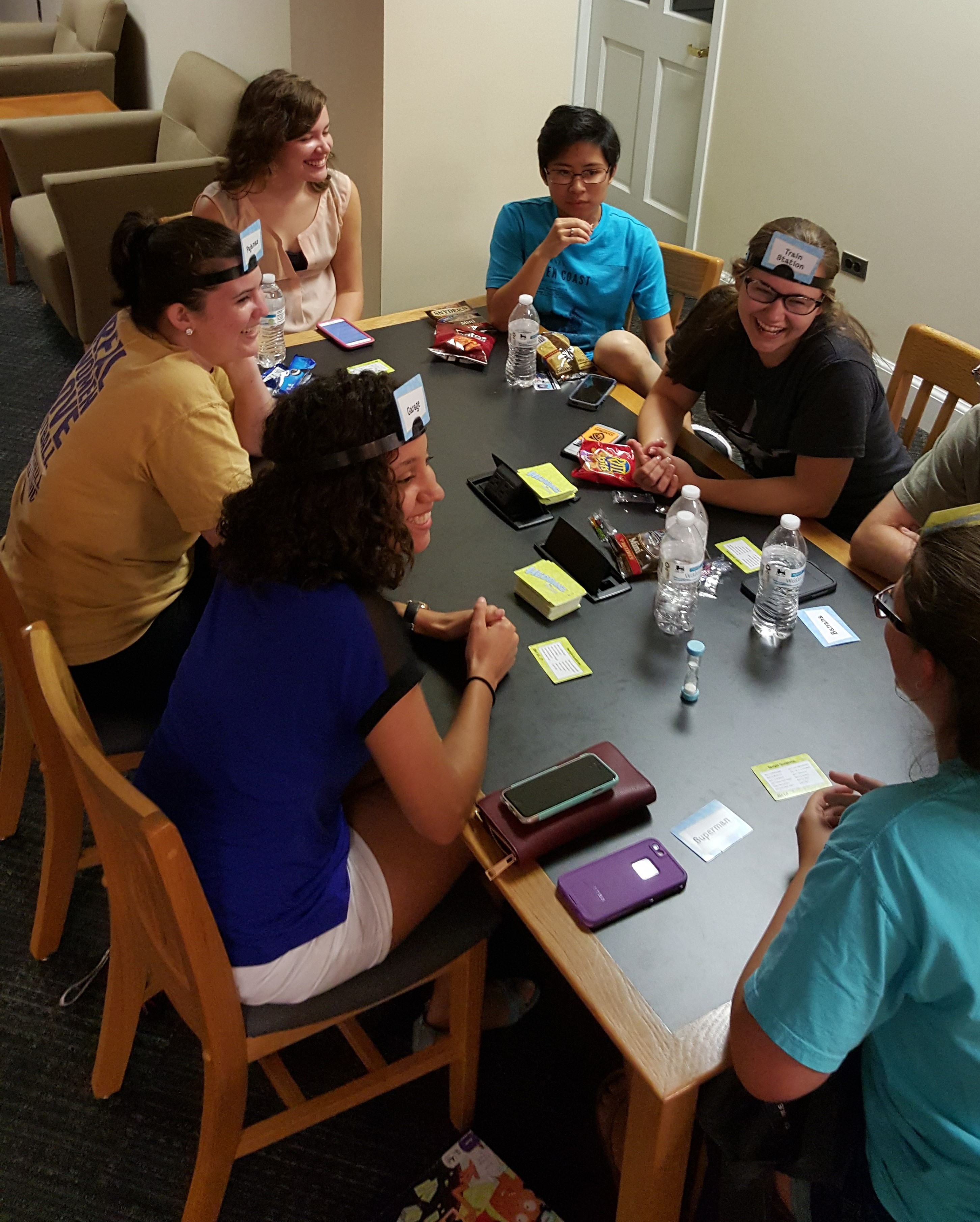 Group of students playing a board game