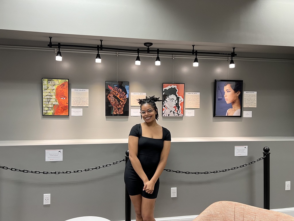 Artist, Rachel Dickerson, with her art display - July 2022